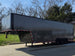8.5x32 Gooseneck with 3-7K axles Charcoal Grey Open front right angle picture 