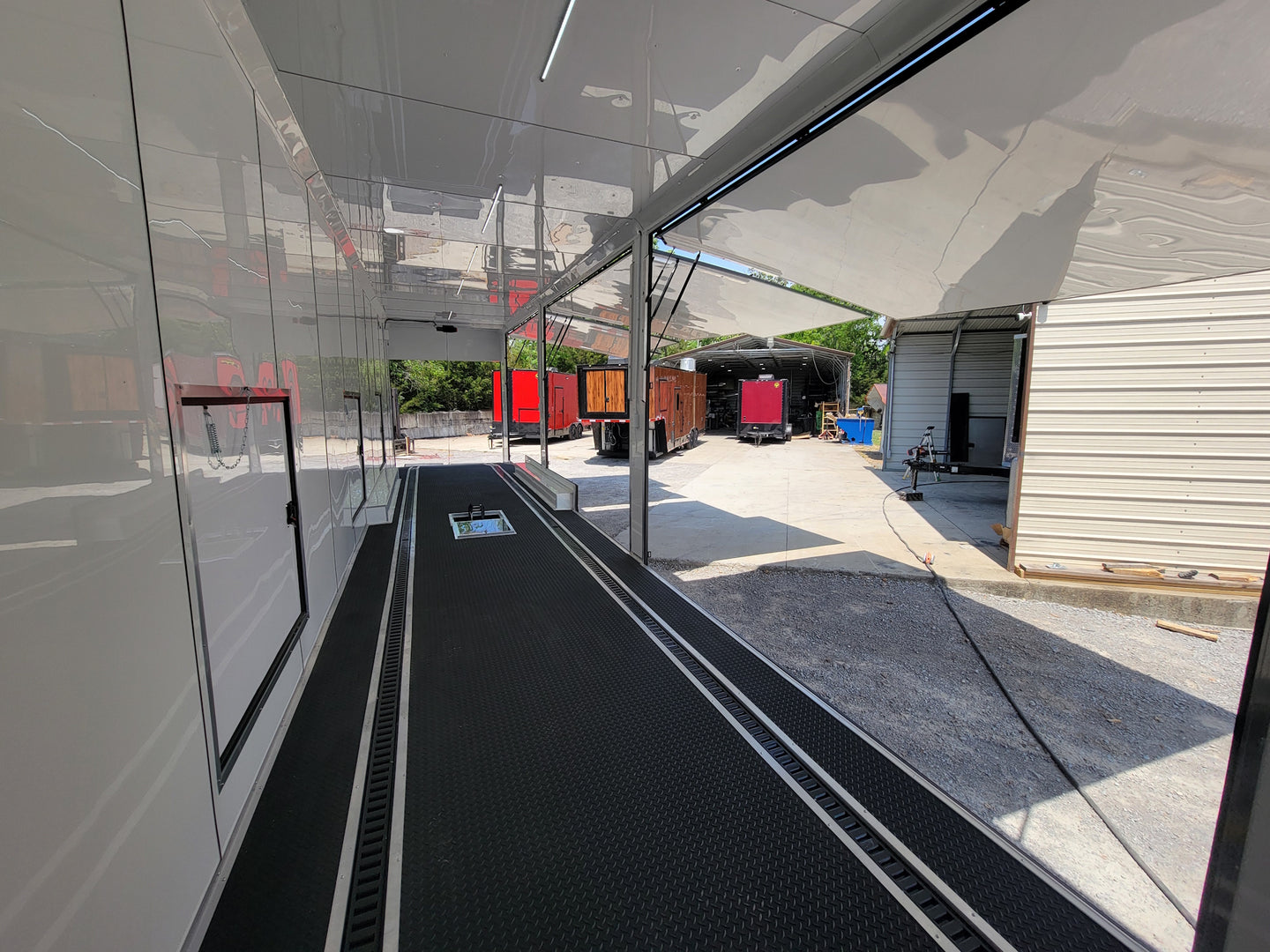 8.5x53 Gooseneck Black Showcase Car Hauler With Beaver Tail Interior front left angle picture 