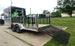 7x20 Black Hybrid Enclosed Trailer ATP Floor (2) 7K Axles Left Side with Trimmer Rack and Gas Tank Holders