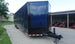 8.5X36 Indigo Blue With Black Out Enclosed Trailer With Escape Doors E Track Floor (3) 7K Axles 21K GVWR Front Right Side