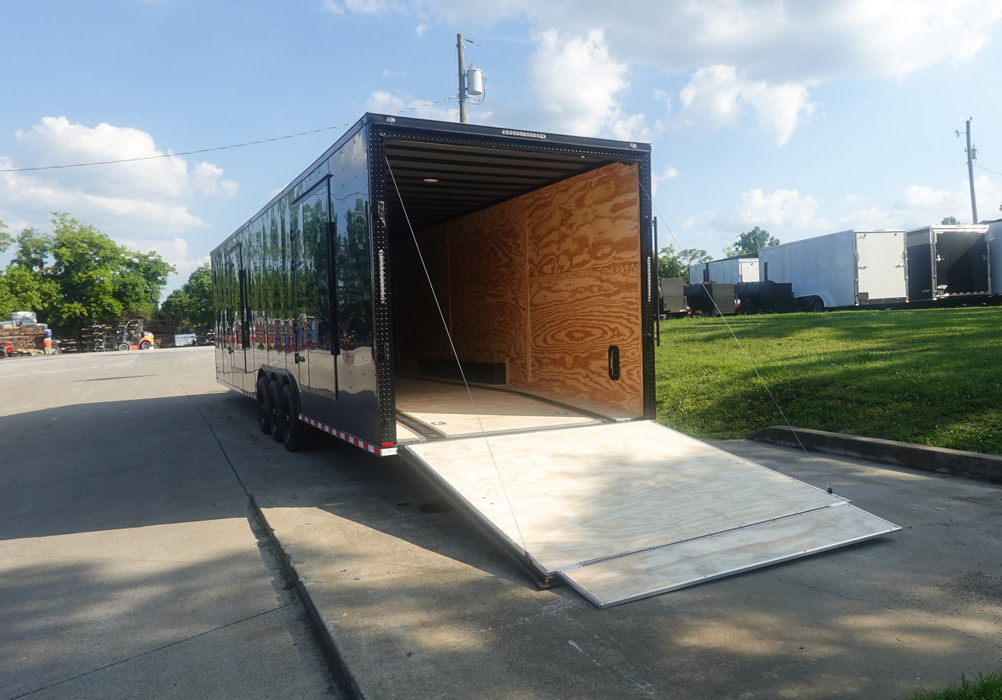 8.5X36 Indigo Blue With Black Out Enclosed Trailer With Escape Doors E Track Floor (3) 7K Axles 21K GVWR Rear Ramp Down Left