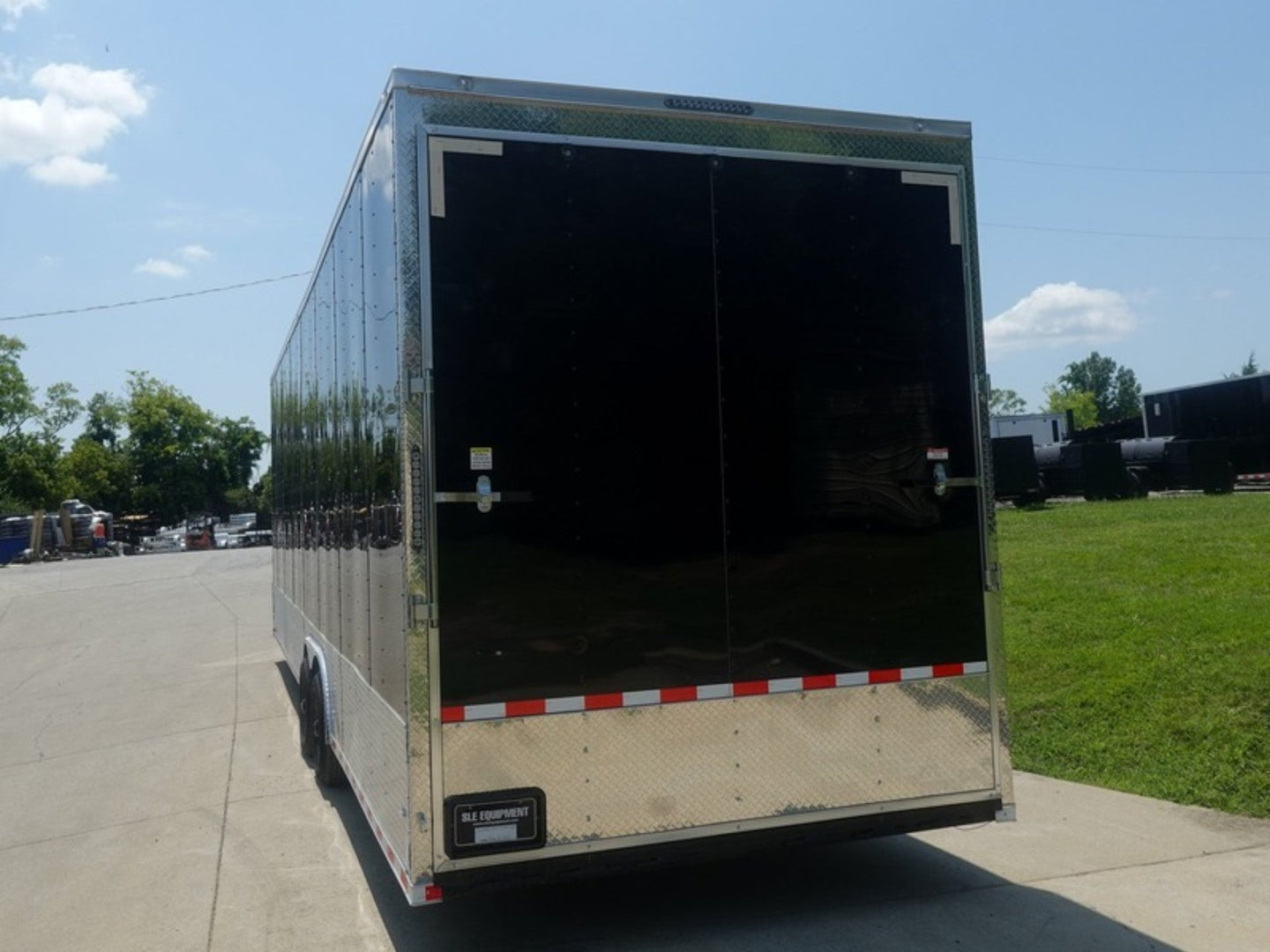 8.5x30 Black Enclosed 2-5200lb Axles 9' Interior Height with Winch Rear Left