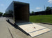 8.5x30 Black Enclosed 2-5200lb Axles 9' Interior Height with Winch Rear Ramp Lowered Left Side