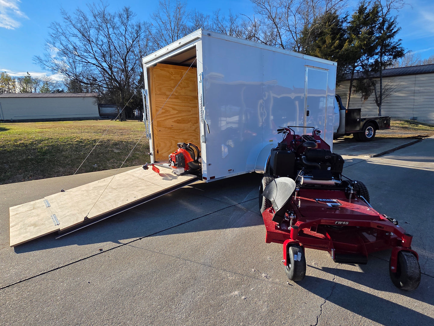 Ferris 5901891 FW45 52" Walk Behind Mower Encl Trailer Handheld Bundle left front angled view picture with ramp down 