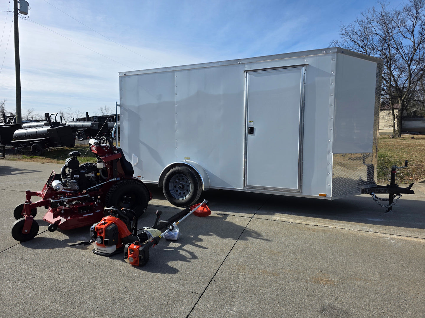 Ferris 5901940 SRSZ1 48" Stand-On Mower 6x12 Enclosed Trailer Handheld Package front right angled view picture 
