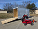 Ferris 5901940 SRSZ1 48" Stand-On Mower 6x12 Enclosed Trailer Handheld Package left view picture with ramp down