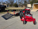 Ferris 5901940 SRSZ1 48" Stand On Mower 5x10 Utility Trailer Package (Instant Rebate Included) left view angled picture with ramp down