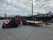 Ferris 5902064 ISX3300 60" Zero Turn Mower Util Trailer Bundle right angled view picture with ramp up 