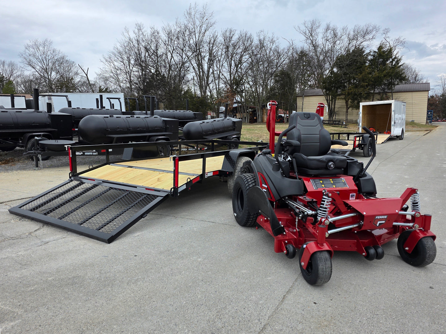 Ferris 5902065 ISX3300 60" Zero Turn Mower Util Trailer Bundle (Instant Rebate Included) front left angled view picture with ramp down 