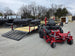 Ferris 5902065 ISX3300 60" Zero Turn Mower Util Trailer Bundle (Instant Rebate Included) front left angled view picture with ramp down 