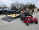 Ferris 5902065 ISX3300 60" Zero Turn Mower Util Trailer Bundle (Instant Rebate Included) front left angled view picture with ramp down 