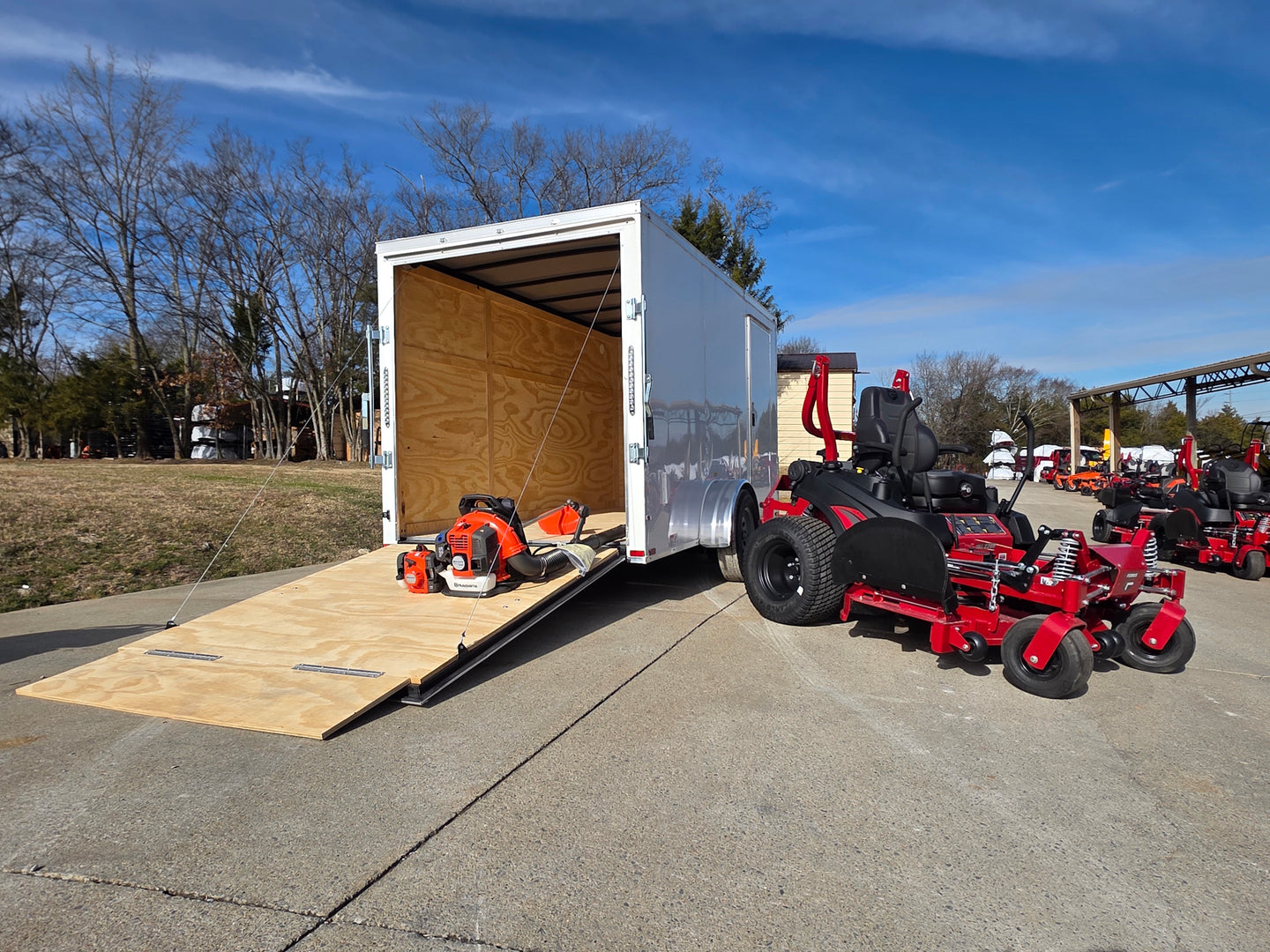 Ferris 5902078 ISX2200 60" Zero Turn Mower Encl Trailer Handhelds Bundle left angled picture with ramp down 
