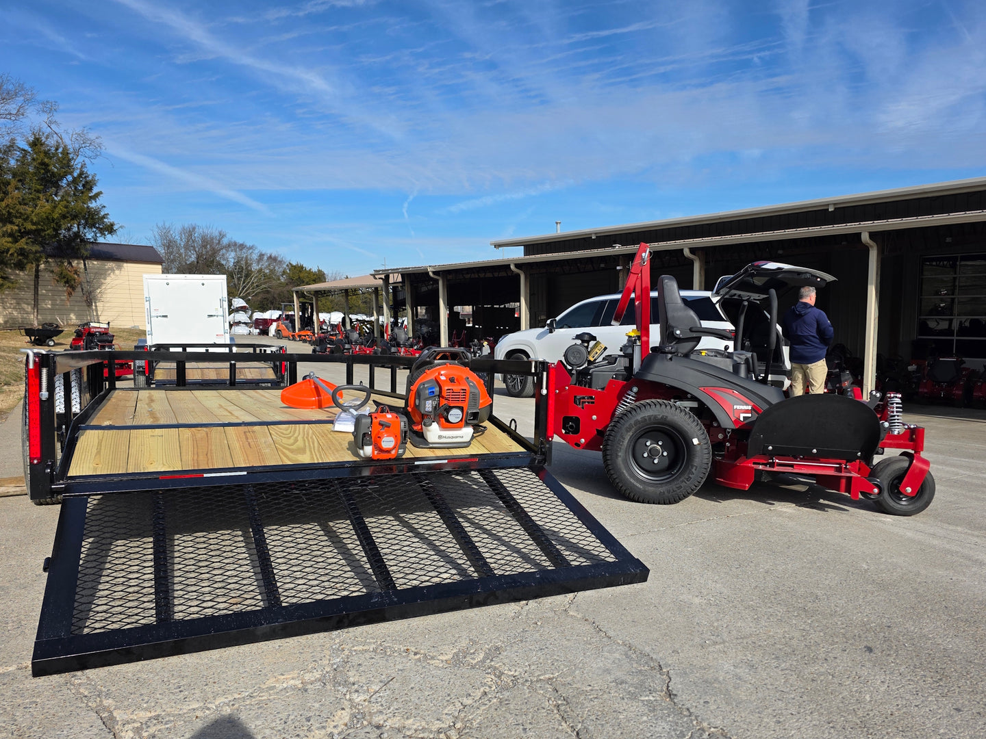 Ferris 5902078 ISX2200 60" Zero Turn Mower Util Trailer Handhelds Bundle back view picture with ramp down 