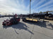 Ferris 5902078 ISX2200 60" Zero Turn Mower Utility Trailer Bundle (Instant Rebate Included) right angled view picture with ramp up 
