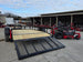 Ferris 5902103 61" 500S Zero Turn Mower Util Trailer Package left side view picture with ramp down
