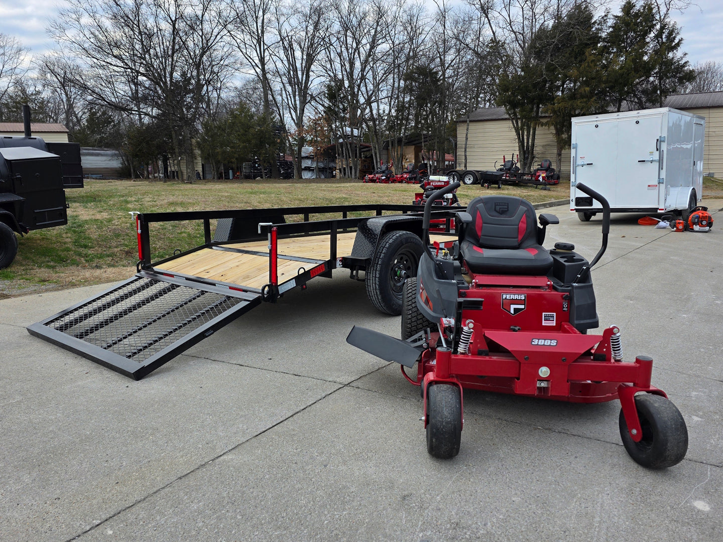 Ferris 5902144 42" 300S Zero Turn Mower Util Trailer Bundle left angled view picture with ramp down