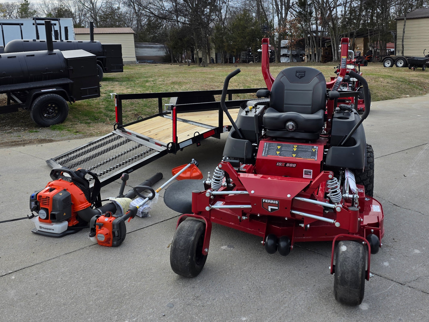 Ferris 5902154 52" ISX800 Commercial Zero Turn Mower Utility Trailer Handheld Bundle left angled view mower picture 