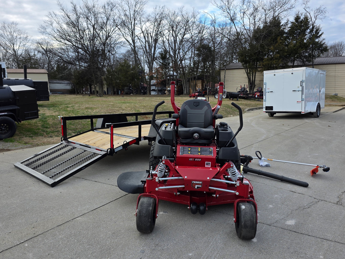Ferris 5902154 52" ISX800 Commercial Zero Turn Mower Utility Trailer Handheld Bundle left angled view picture 