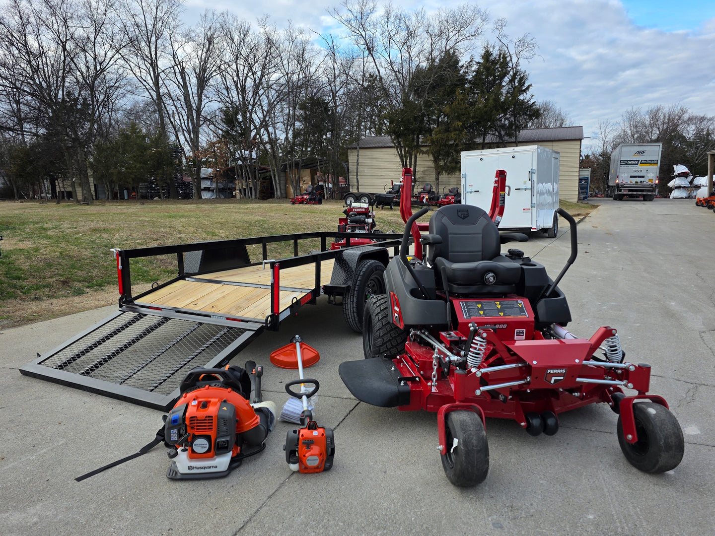 Ferris 5902154 52" ISX800 Commercial Zero Turn Mower Utility Trailer Handheld Bundle left angled with hand held picture 