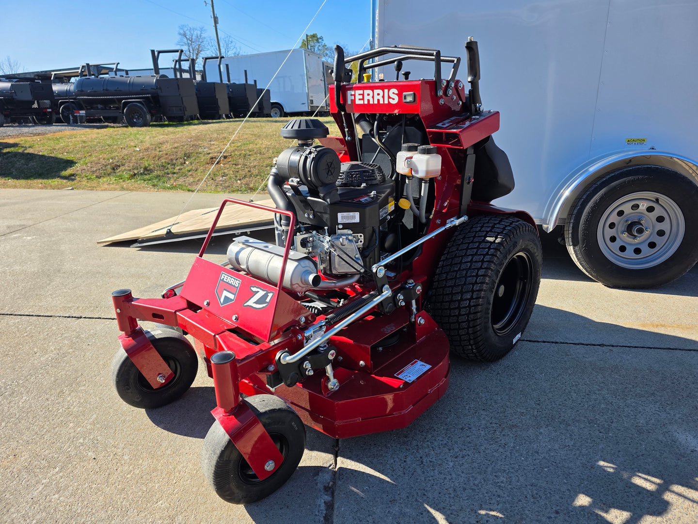 Ferris SRS Z1 36" 19HP 5901939 Kawasaki Stand-On Mower Handhelds Enclosed Trailer Bundle close up angled view picture 