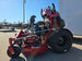 Ferris SRS Z1 36" 19HP 5901939 Kawasaki Stand-On Mower Handhelds Enclosed Trailer Bundle close up side view picture 