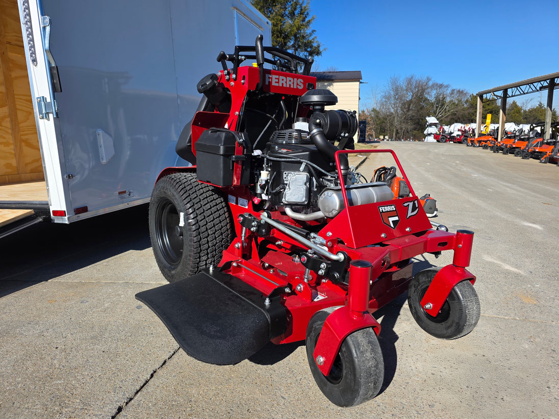 Ferris SRS Z1 36" 19HP 5901939 Kawasaki Stand-On Mower Handhelds Enclosed Trailer Bundle close up with ramp down view picture 