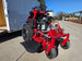 Ferris SRS Z1 36" 19HP 5901939 Kawasaki Stand-On Mower Handhelds Enclosed Trailer Bundle close up with ramp down view picture 