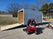 Ferris SRS Z1 36" 19HP 5901939 Kawasaki Stand-On Mower Handhelds Enclosed Trailer Bundle left angled with ramp down view picture 