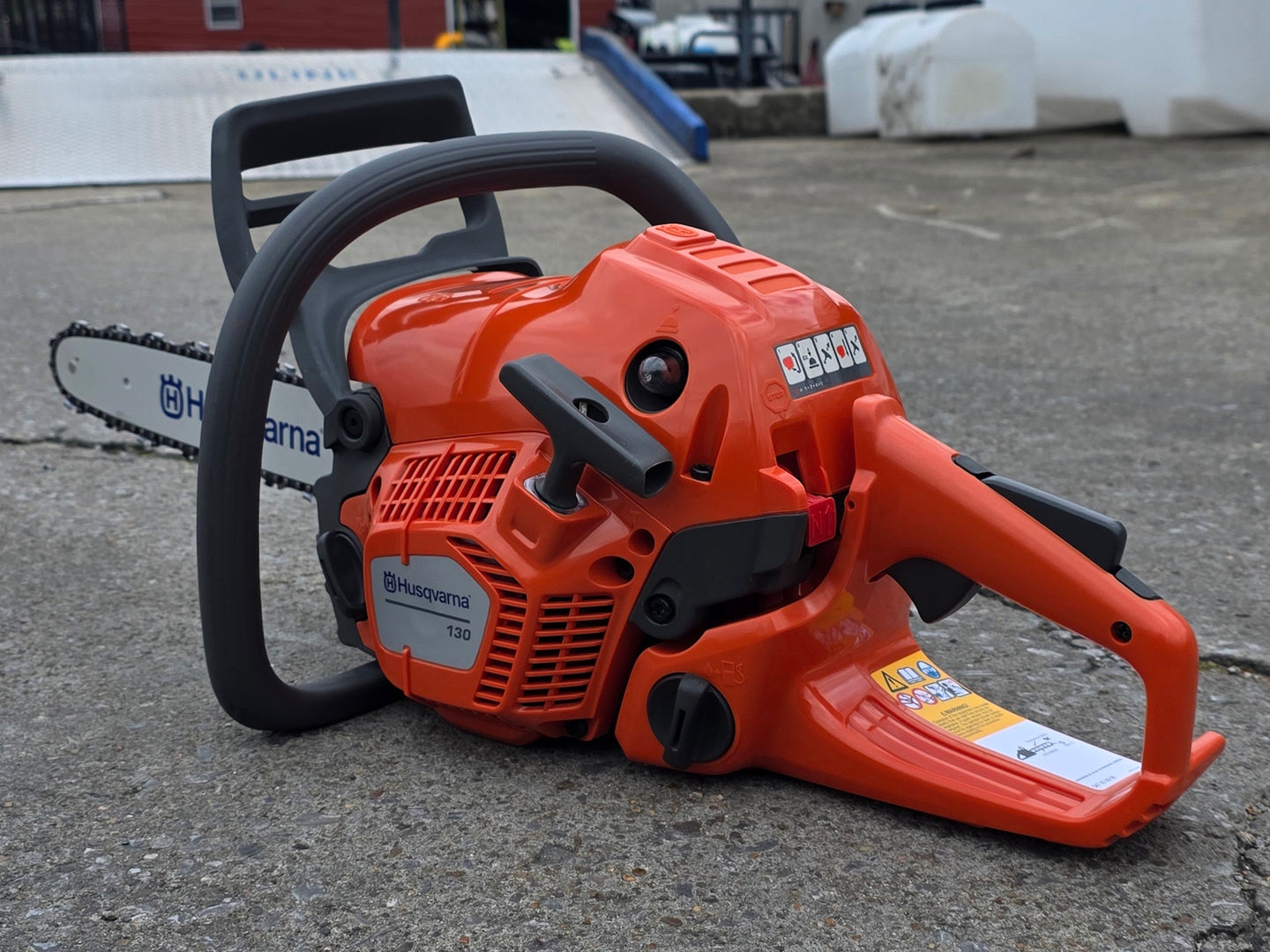 Husqvarna 130 Gas Powered 16" Chainsaw .050 Gauge - Bar & Chain Included (Unboxed) Back left angle picture 