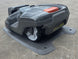 Husqvarna Automower® 310 Robotic Mower charging back left angle picture 