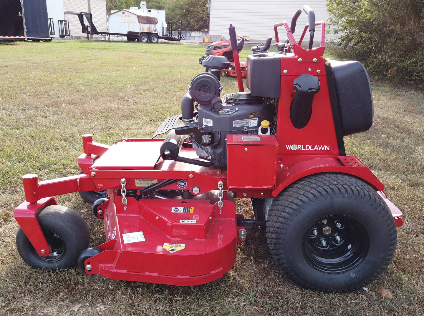 WorldLawn Venom Stand-On Walk Behind Mower Front Left - 36" Shown