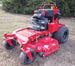 WorldLawn Venom Stand-On Walk Behind Mower Front Left - 36" Shown