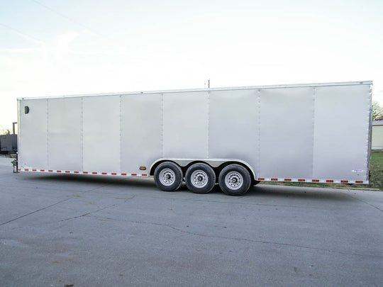 8.5 x 32 Silver Flat Nose Enclosed Trailer with (3) 7K Axles