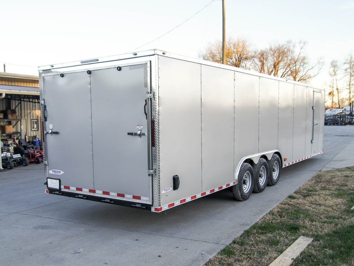 8.5 x 32 Silver Flat Nose Enclosed Trailer with (3) 7K Axles