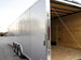 8.5 x 32 Silver Flat Nose Enclosed Trailer with (3) 7K Axles