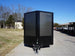 Enclosed Trailer 7x16 Charcoal V-Nose with Blackout Package Side Angle with Entry Door