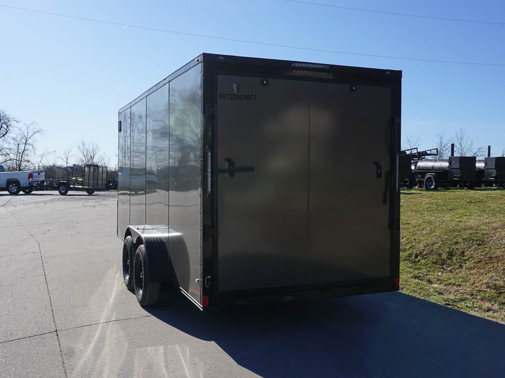 Enclosed Trailer 7x16 Charcoal V-Nose with Blackout Package Side Angle with Entry Door