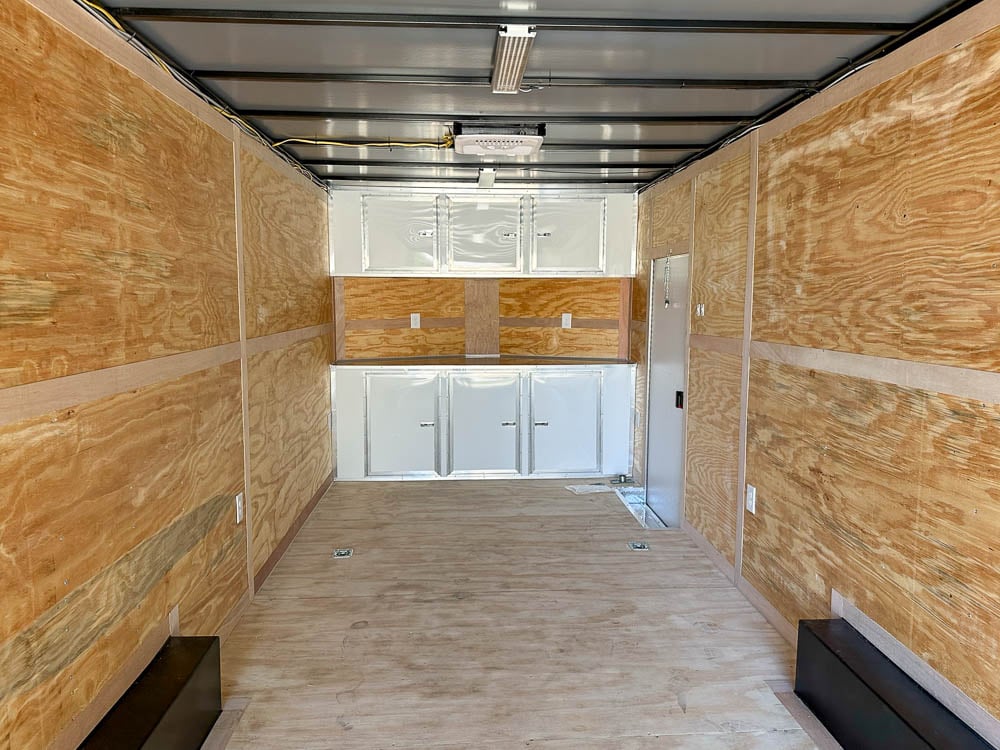 8.5x24 V-Nose Tandem Enclosed Trailer with Elect Pkg A/C and Cabinets