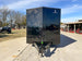 8.5x28 Black V-Nose Enclosed Trailer with Blackout Pkg (2) 7K Axles